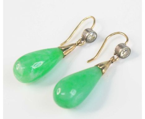 A pair of yellow metal, jadeite and diamond drop earrings, each featuring a 20mm green jadeite drop suspended below an Old Eu