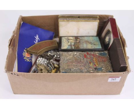 A collection of miscellaneous items to include a Royal Armoured Corps cap badge, two pairs of Royal Marines Commando cloth sh