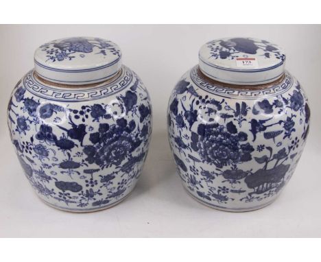 A pair of Chinese blue and white pottery ginger jars and covers, h.24cmOverall in good condition with the usual firing marks 