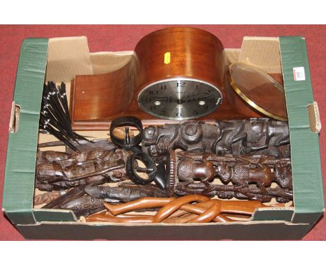 A box of various African carved hardwood figures and a reproduction Nelson's hat mantel clock 