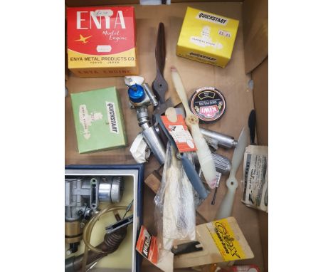 A collection of model airplane engines, propellers and accessories 