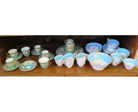 A Victorian gilt and green ground part tea service, and another light blue part tea service 
