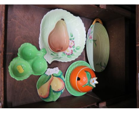 A Carltonware orange form preserve pot, with lid and saucer, and five other pieces of the period 
