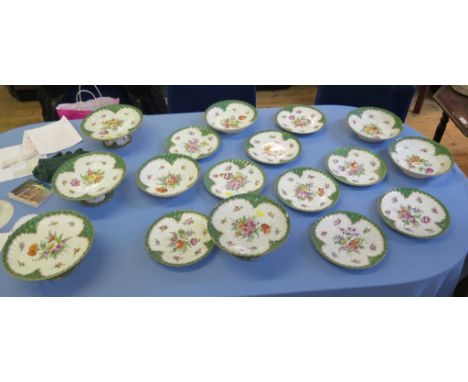 A set of Dresden tablewares, all with floral decoration within a green scale border, including nine side plates, 21 cm diamet