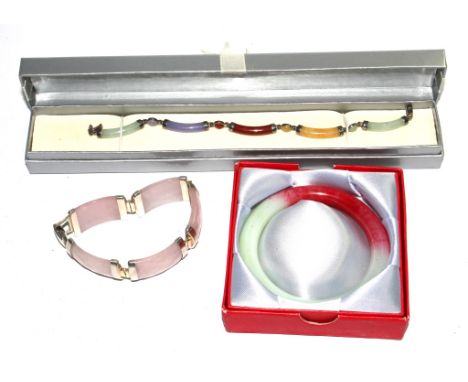 A vintage multi-coloured jade bangle, red and green, together with a 925 silver set multi-coloured jade bracelet and another 