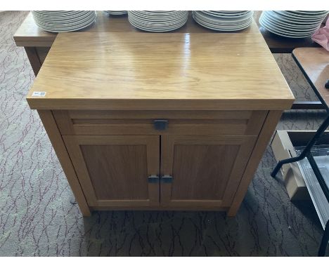 Light oak two door cabinet and a side table with two drawers- LOT SUBJECT TO VAT ON THE HAMMER PRICE - To be collected by app