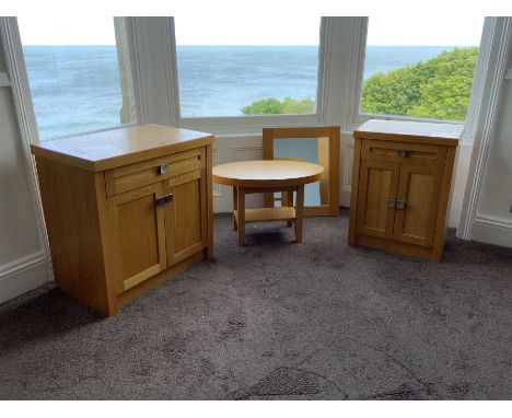 Two light oak side cabinets, oval table and wall mirror- LOT SUBJECT TO VAT ON THE HAMMER PRICE - To be collected by appointm