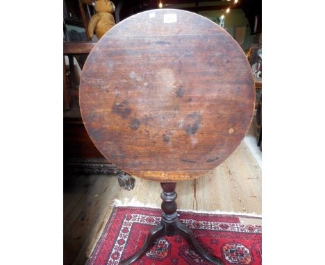 A late Victorian mahogany tilt-top tripod table, 61cm diameter.