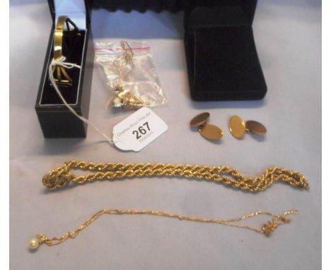 A mixed parcel of gold, to include: a 9 carat gold pair of cufflinks, a 9 carat gold Art Nouveau-style bangle in fitted case,