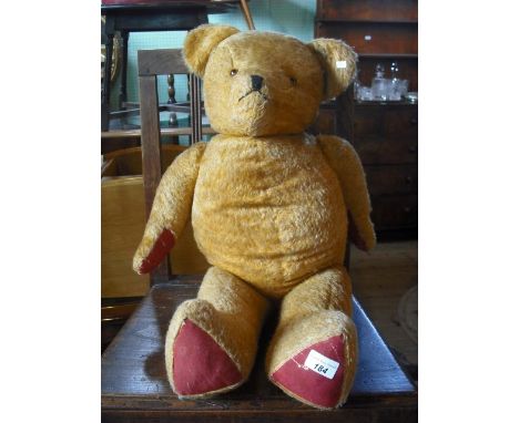 A mid-20th century mohair teddy bear, 74cm.