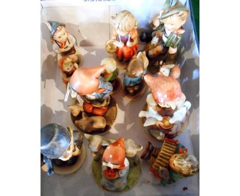 A collection of twelve Goebel figurines, various sizes.