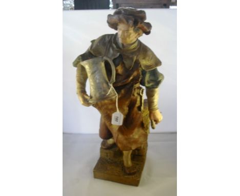A Goldscheider figure of a silversmith, carrying a hammer and a jug on a square base, incised marks to reverse, 53cm.