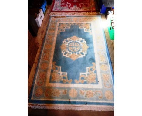 A contemporary Chinese rug, blue central panel and light blue outer border, 119 x 182cm.