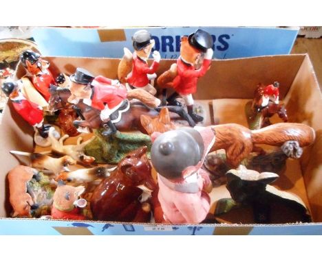 A quantity of ceramic and resin hunting related figurines