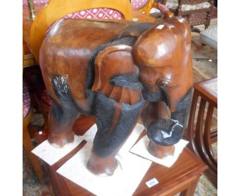 A large hardwood model of an Indian elephant, possibly fashioned as a stool, 50cm high.