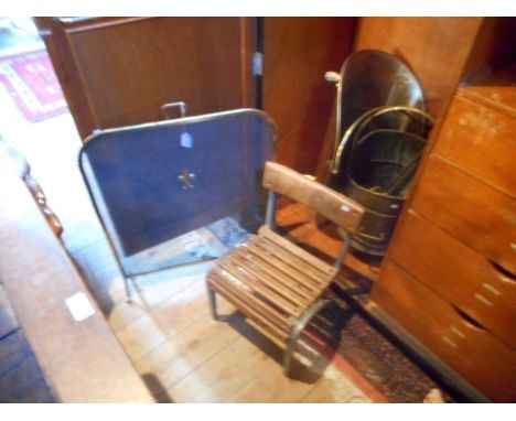 A brass framed mesh fire screen, together with a quantity of fire irons, a coal bin, a log bin, a child's cast aluminium scho