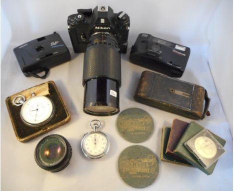 A Voigtlander camera, a modern Nikon camera with fitted large lense, two smaller cameras, a cased Nero stopwatch and various 