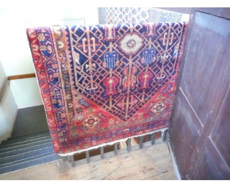 A Bakhtiar Persian carpet, the diamond central lozenge decorated with geometric shapes, 100% wool 145 x 114cm.