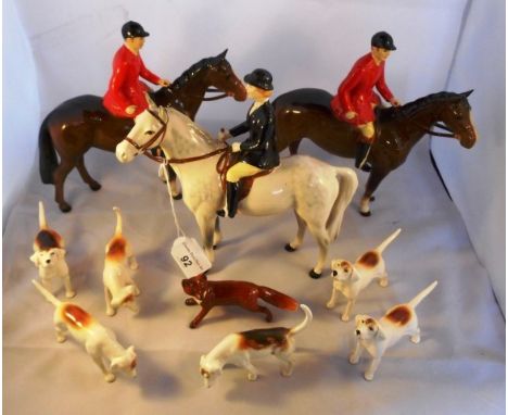 A Beswick hunting group, comprising: two Huntsman on horseback, numbered S1501, a Huntswoman, numbered S1730, together with s