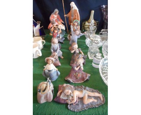 A collection of twelve figurines, to include: Nao, Jesus, Mary and Joseph and others.