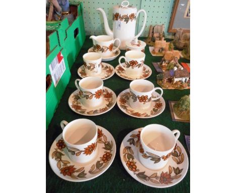 A Wedgwood Susie Cooper design coffee service, 'Brown Art Nouveau', comprising: coffee pot, milk jug, sugar bowl and six cups