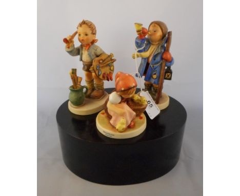 Three Goebel figurines, to include: Chick Girl no. 57, The Artist no 304 and another, Hear Ye, Hear Ye, no.15.