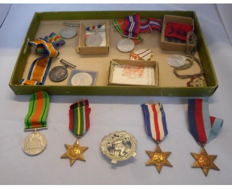 A collection of WWI and WWII medals: a WWI Defense medal and War medal, each named to 2802 Private P Whatmough, of the Lancas