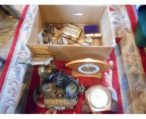 A box containing a brass twin inkwell and stand, two decorative hinged trinket boxes, two modern mantle clocks and other item