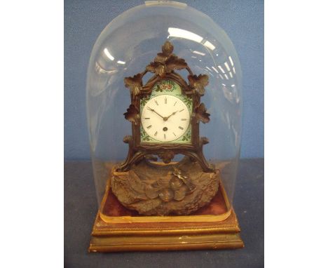 Unusual Victorian clock with white enamel dial within a floral border, in carved Black Forest style oak frame and similar bas