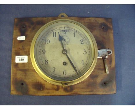 Brass cased bulk head wall clock with steel dial (diameter 17cm) 