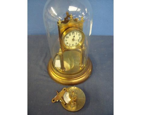 400 day brass clock with white enamel dial  under glass dome (30cm high) 
