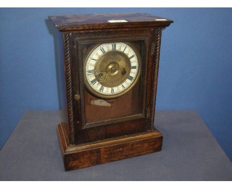 Late 19th C continental oak cased striking mantel clock with rope twist columns 