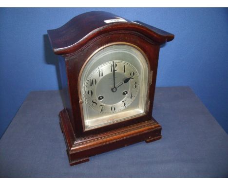 Early 20th C Junghans mahogany cased striking mantel clock, silver dial and chapter ring bearing retailers name Fattorini and