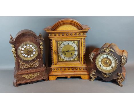An early 20th Century walnut mantle clock together with two other mantle clocks 