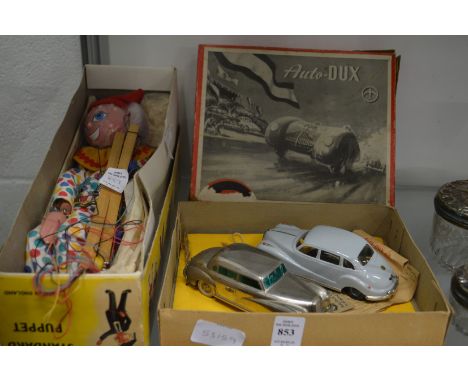 An Auto-Dux boxed pair of model cars together with a Pelham puppet.