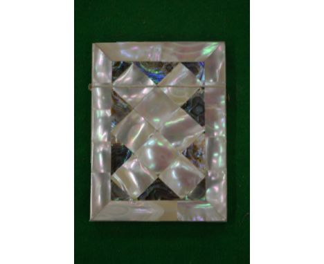 A Victorian mother of pearl calling card case.