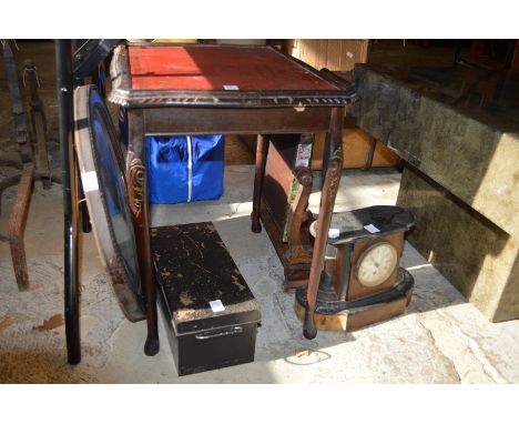 Household furniture and a mantel clock.