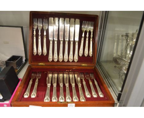A cased set of twelve fish knives and forks (lacking one fork).