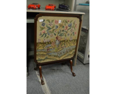 A folding fire screen/table.