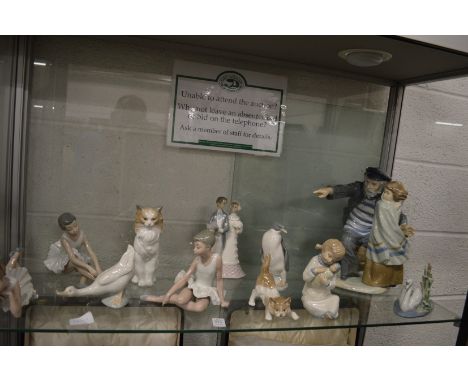 A large Nao group of a fisherman and a young girl together with Lladro and similar items.