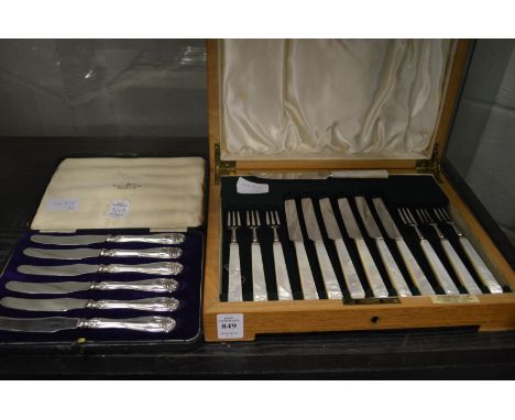 A Harrods cased set of six fruit knives and forks with mother of pearl handles together with a cased set of six butter knives