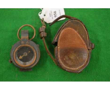 A leather cased military compass.