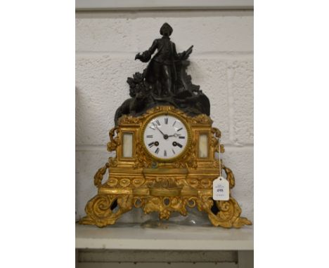 Decorative figural mantel clock.