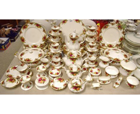 A Royal Albert Old Country Roses six setting tea service, comprising a graduating pair of tea pots, six tea cups and saucers,