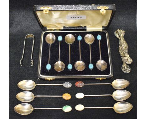 A set of six Chinese silver teaspoons, the crest set with carved jade style panels, marked silver; a set of six coffee beans 