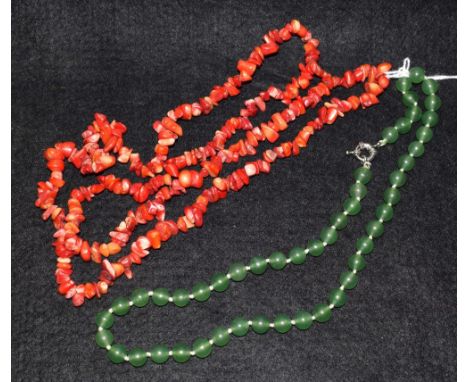 A jade bead necklace; a coral necklace (2)