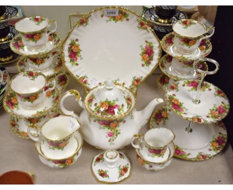 A Royal Albert Old Country Roses pattern six setting tea service, including tea pot, two tier cake stand, milk and cream jugs