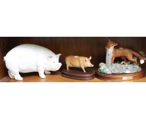 A heavy ceramic pig with another on plinth and a Doulton fox