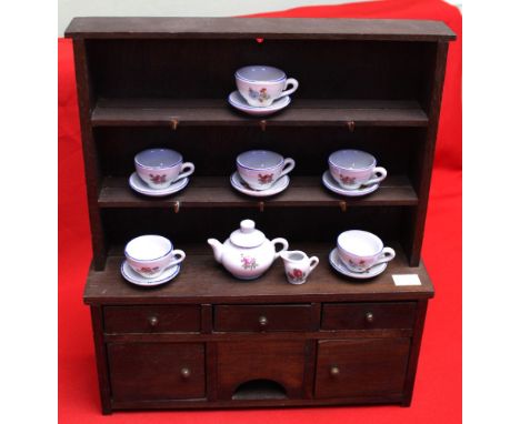 A Dolls miniature stained wood dresser with plate rack back 35cm high, together with a quantity of miniature ceramic teaware