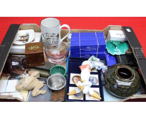 A box of collectors items, includes decorative coins, ceramic wares, a "Villeroy and Boch" angel, cased cast feather letter o